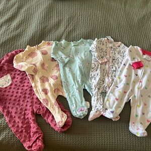 Baby Girl footie pajamas in various prints and materials. Like new, hardly used